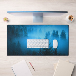 Magical fog in snowy spruce forest desk mat