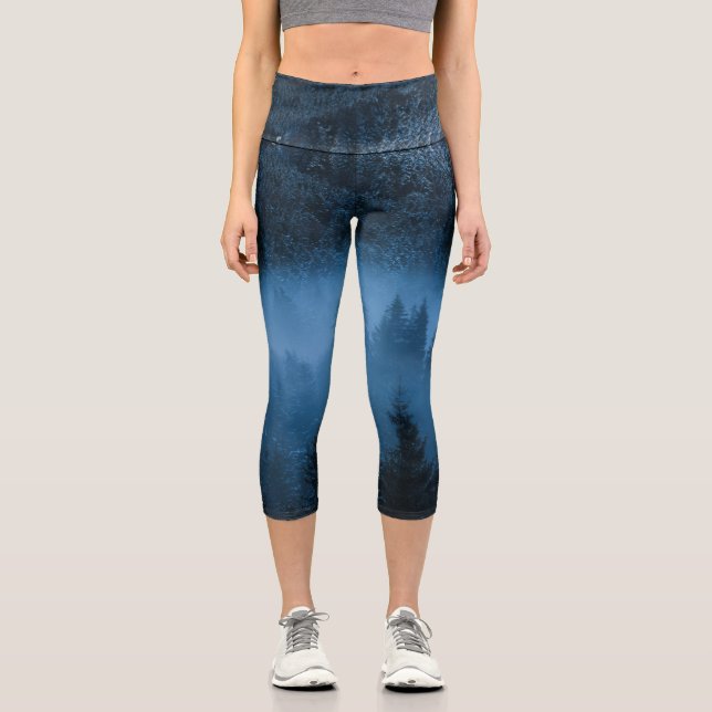 Magical fog over snowy spruce forest capri leggings (Front)