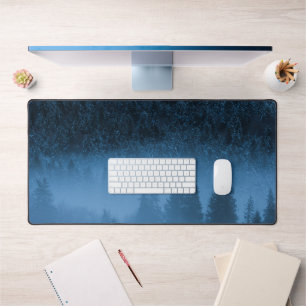 Magical fog over snowy spruce forest desk mat