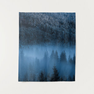 Magical fog over snowy spruce forest tapestry