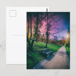 Magical night sky in a park with colourful sky postcard