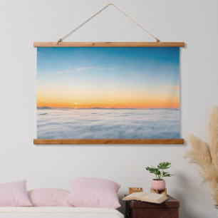 Magical sunrise above clouds hanging tapestry