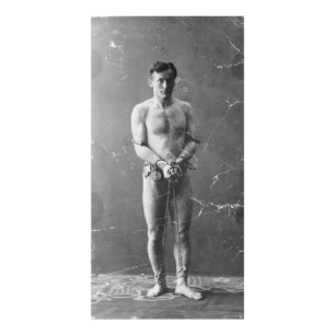 Magician Harry Houdini Standing In Chains Photo Print
