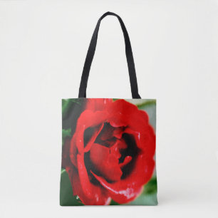 Magnificent red rose with morning dew drops tote bag