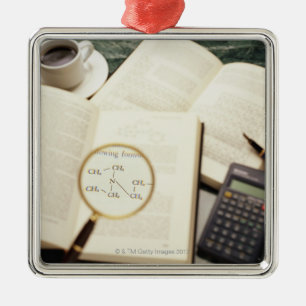 Magnifying glass enlarging molecular diagram metal ornament