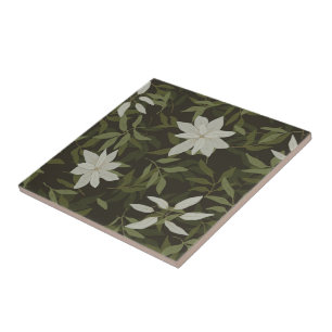 Magnolia and green leaves on black ceramic tile