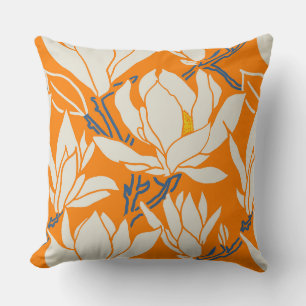 Magnolia graphic in orange pattern cushion