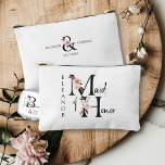 Maid of Honour Flower Letter Boho Floral Custom Accessory Pouch<br><div class="desc">Maid of Honour accessory bag to personalise. Maid of Honour is lettered with neutral boho floral letters and handwritten script. You can also add the name of the bride and groom and their wedding date, which frames a co-ordinating floral ampersand. Lovely wedding party keepsake gift and perfect for a fall...</div>