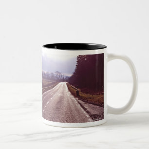 Main road with low winter sun. Two-Tone coffee mug