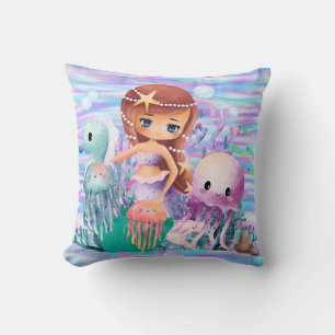 Mairmaid witha star in the hair playing in the oce cushion