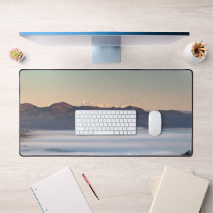Majestic mountain Triglav with fog in valley Desk Mat