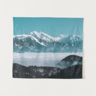 Majestic mountains rising over foggy valley tapestry