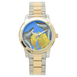 Malaysian blue clipper butterflies on Canna King Watch