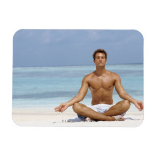 Maldives, Handsome young man meditating in a Magnet