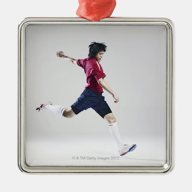 Male soccer player preparing to kick ball metal tree decoration (Front)