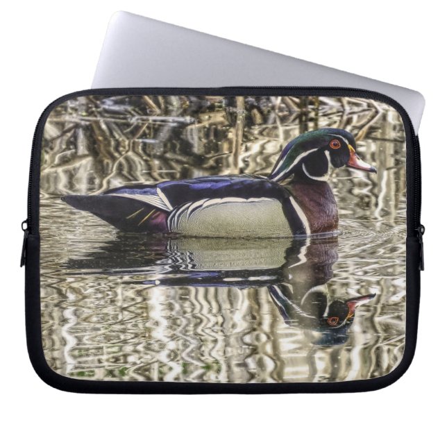 Male wood duck swimming in pond laptop sleeve (Front)