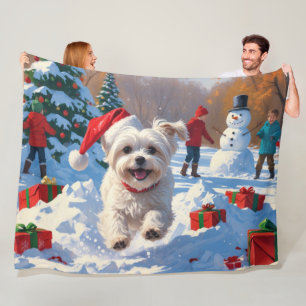 Maltese Dog Running in Snow with Christmas Hat Fleece Blanket