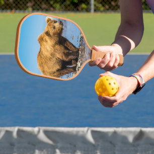 Mama bear watching her two kids pickleball paddle