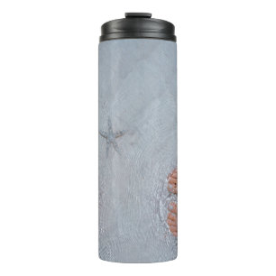 Man and woman on seashore nearby starfish thermal tumbler