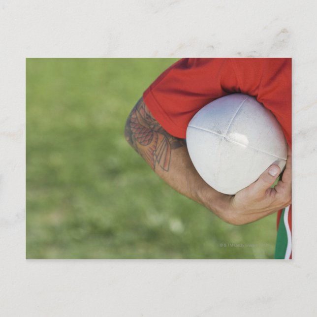 Man carrying rugby ball postcard (Front)