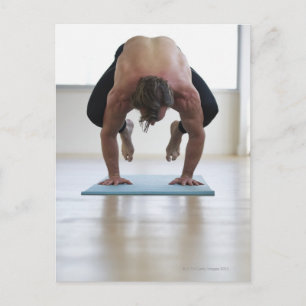 Man doing workout on yoga mat postcard