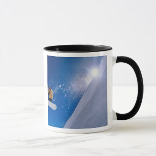 Man flying through the air on a snowboard with mug
