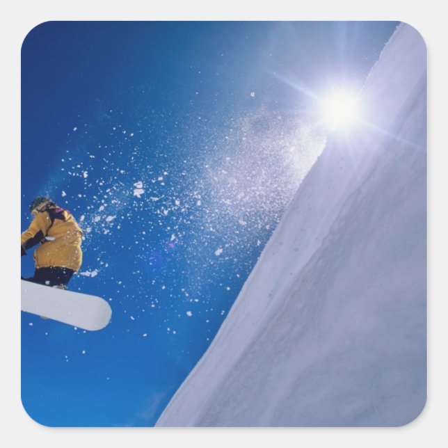 Man flying through the air on a snowboard with square sticker (Front)