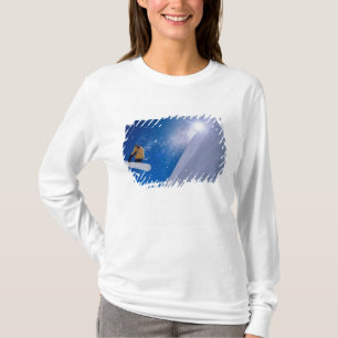 Man flying through the air on a snowboard with T-Shirt