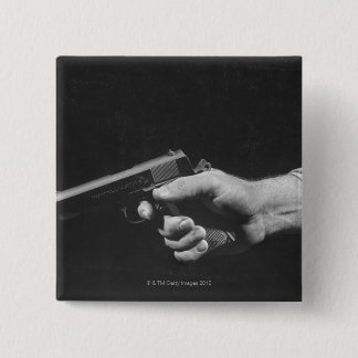 Man Holding Gun 15 Cm Square Badge