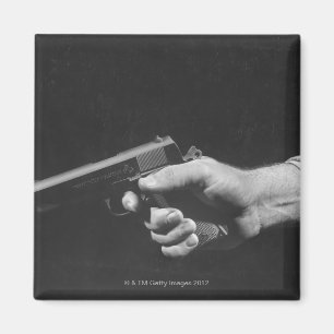 Man Holding Gun Magnet