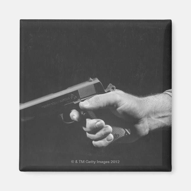 Man Holding Gun Magnet (Front)