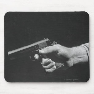 Man Holding Gun Mouse Pad