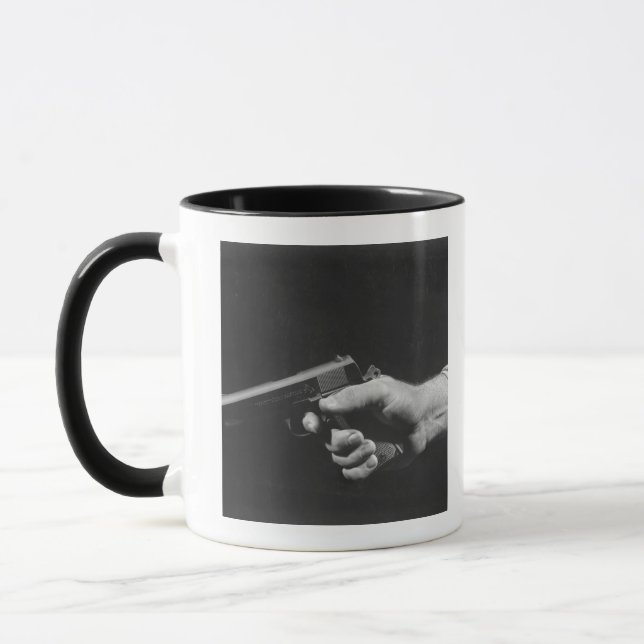Man Holding Gun Mug (Left)