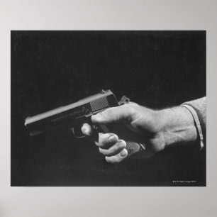 Man Holding Gun Poster