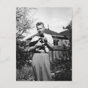man holding kitty postcard