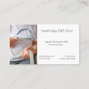 Man holds sleep apnoea device business card