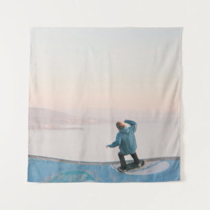 Man in blue skateboarding on wall in beach tapestry