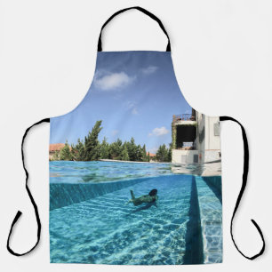 Man in swimming pool in the morning apron