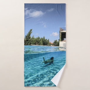 Man in swimming pool in the morning bath towel