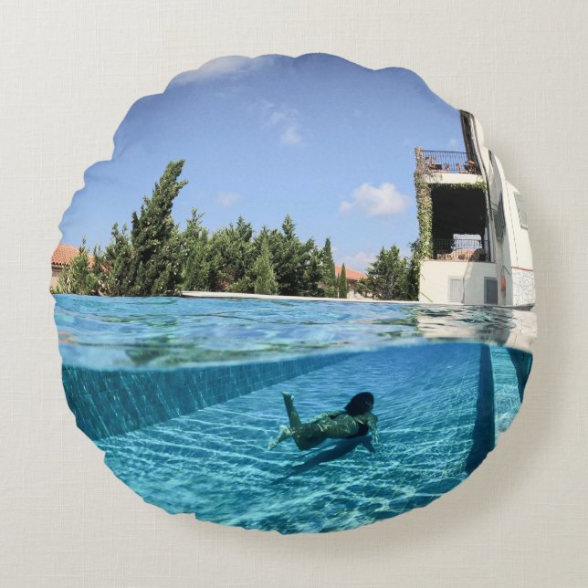 Man in swimming pool in the morning round cushion (Front)