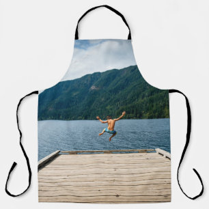 Man jumping near sea apron