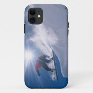 Man jumping off a large cornince on a snowboard iPhone 11 case