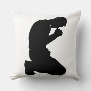 MAN KNEELING IN PRAYER CUSHION