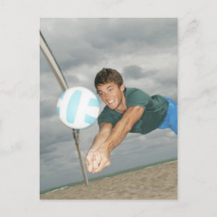 Man playing volleyball on the beach postcard