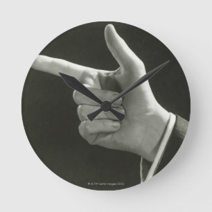 Man Pointing Round Clock