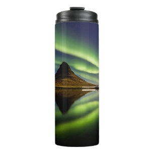 MAN STANDING BESIDE THE BODY OF WATER WITH AURORA THERMAL TUMBLER