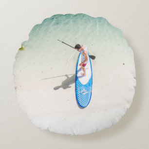 Man surfing on beach round cushion