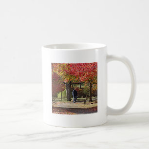 Man Walking Dog in Autumn Park Coffee Mug