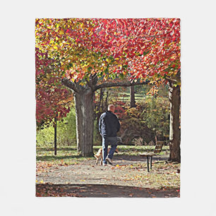 Man Walking Dog in Autumn Park Fleece Blanket