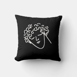 man with curly hair black cushion